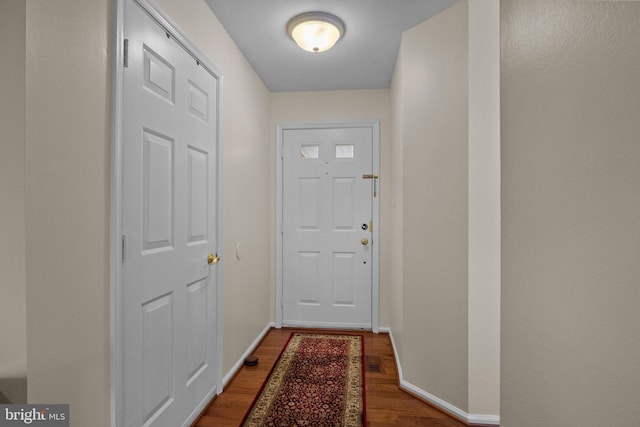 entryway with dark hardwood / wood-style floors