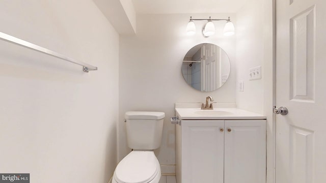 bathroom with toilet and vanity