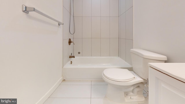 bathroom featuring baseboards, bathing tub / shower combination, toilet, tile patterned floors, and vanity