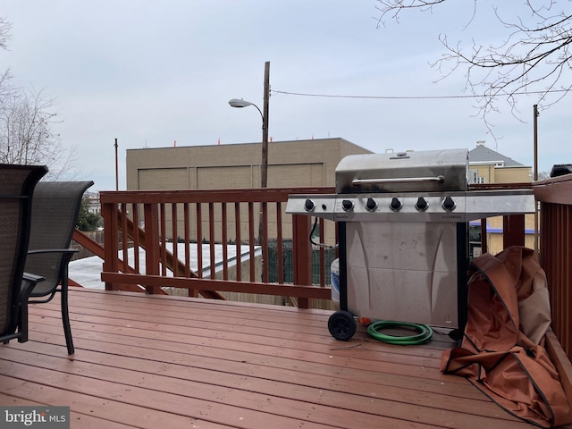 wooden terrace featuring area for grilling