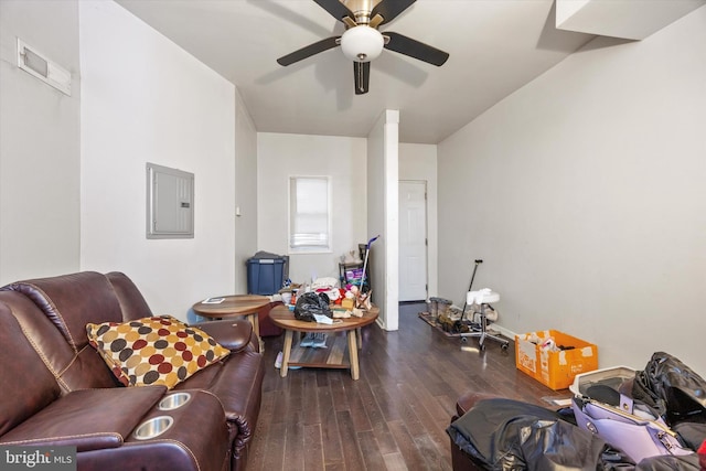 living room with dark wood-type flooring, ceiling fan, and electric panel