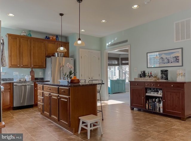 23534 Belmar Dr, Leonardtown, MD 20650 - kitchen with a kitchen island, visible vents, brown cabinets, stainless steel appliances, and recessed lighting