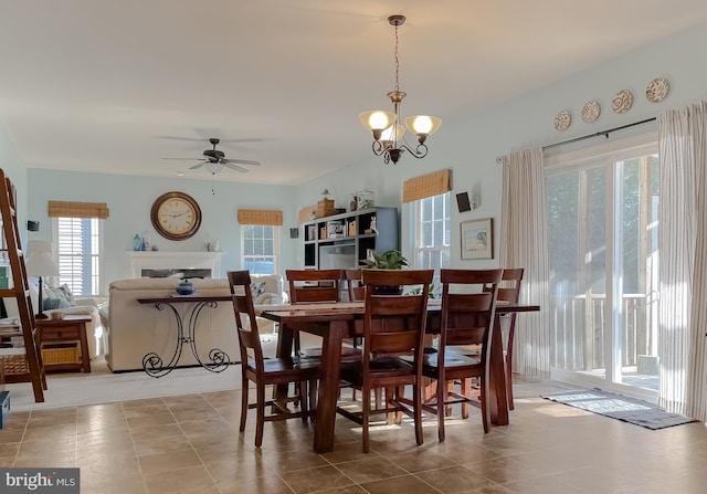 23534 Belmar Dr, Leonardtown, MD 20650 - dining space with ceiling fan with notable chandelier and a high end fireplace
