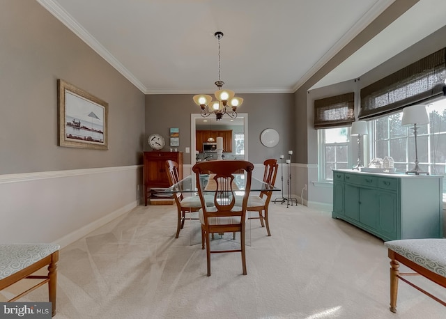23534 Belmar Dr, Leonardtown, MD 20650 - dining space with baseboards, ornamental molding, a notable chandelier, and light colored carpet