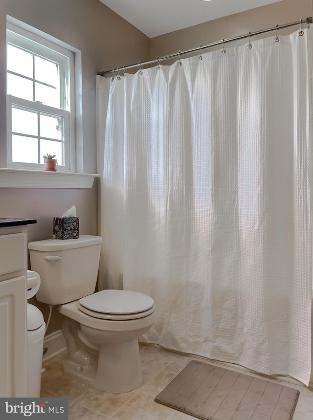23534 Belmar Dr, Leonardtown, MD 20650 - full bath featuring baseboards, tile patterned floors, toilet, and a shower with curtain