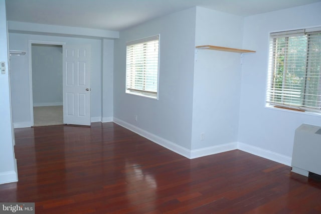 5340 Holmes Run Pkwy Unit 101, Alexandria, VA 22304 - unfurnished room with wood finished floors, baseboards, and healthy amount of natural light