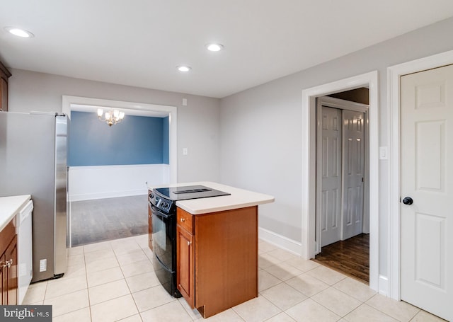 kitchen with black / electric stove, a center island, stainless steel refrigerator, and light tile patterned flooring