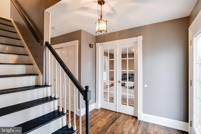 foyer featuring hardwood / wood-style flooring and french doors