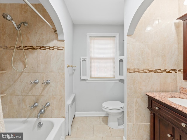 full bathroom with tile patterned floors, vanity, toilet, and tiled shower / bath