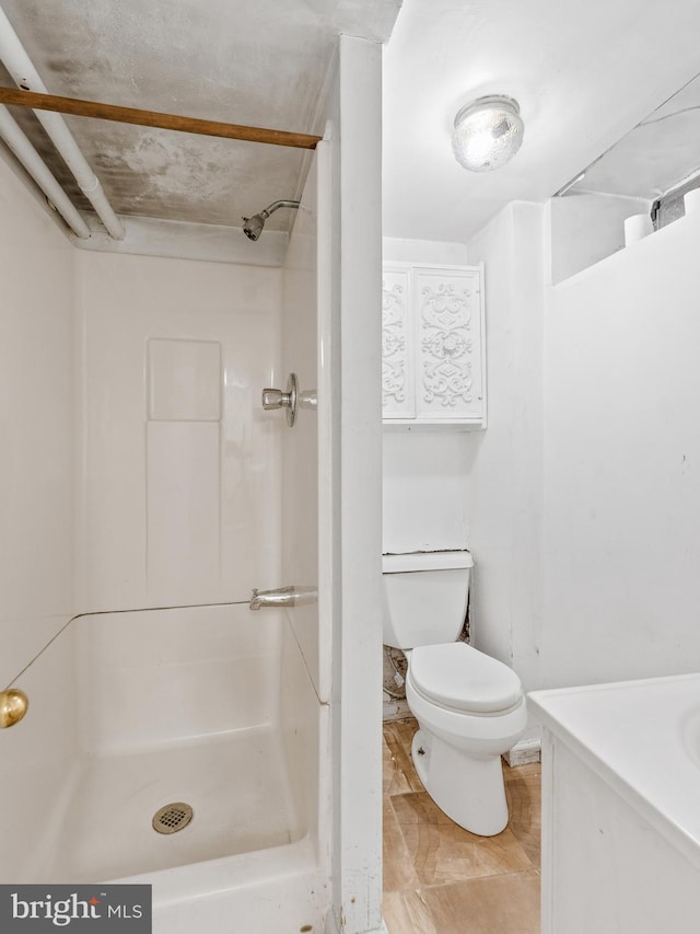 bathroom featuring walk in shower, vanity, and toilet