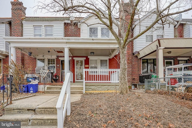 townhome / multi-family property with covered porch