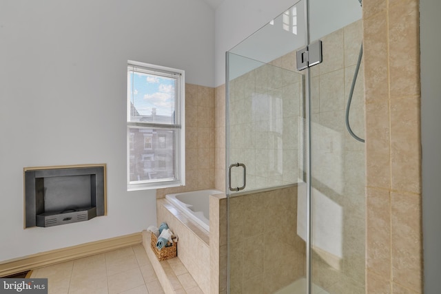 bathroom with tile patterned floors and independent shower and bath