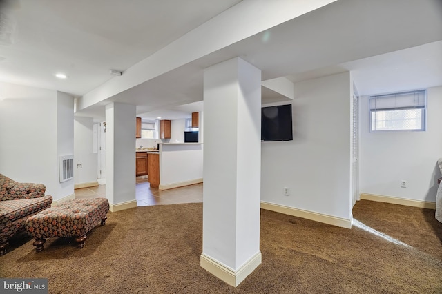 interior space featuring light colored carpet and fridge