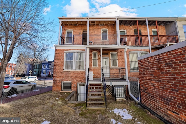 view of front of home with a balcony