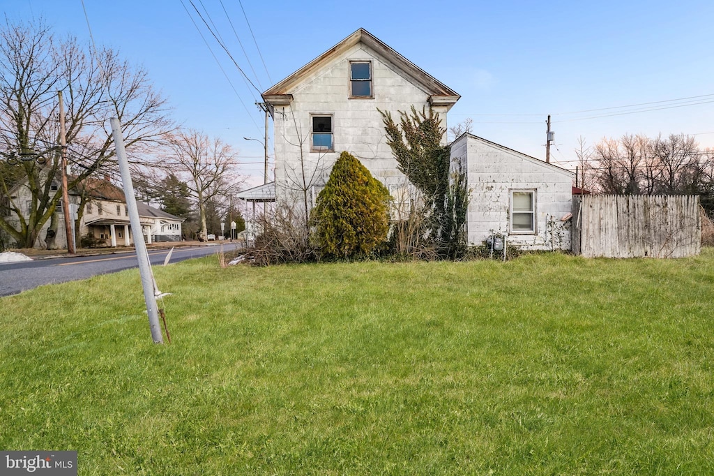 898 Main St, Newport, NJ 08345 - view of home's exterior with a lawn