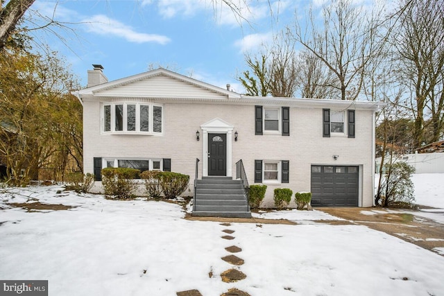 bi-level home featuring a garage