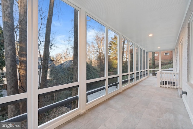 unfurnished sunroom with visible vents