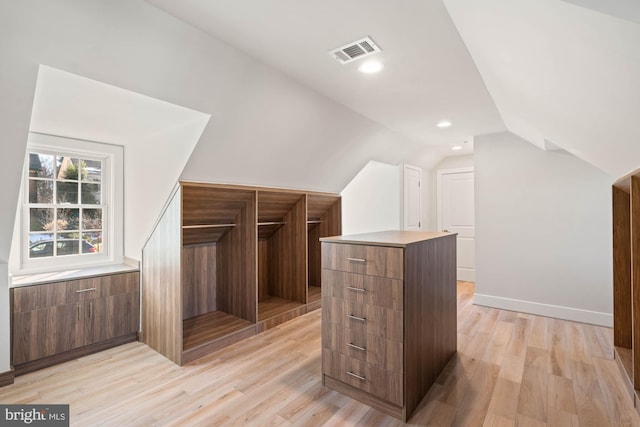 bonus room featuring lofted ceiling, recessed lighting, visible vents, baseboards, and light wood finished floors