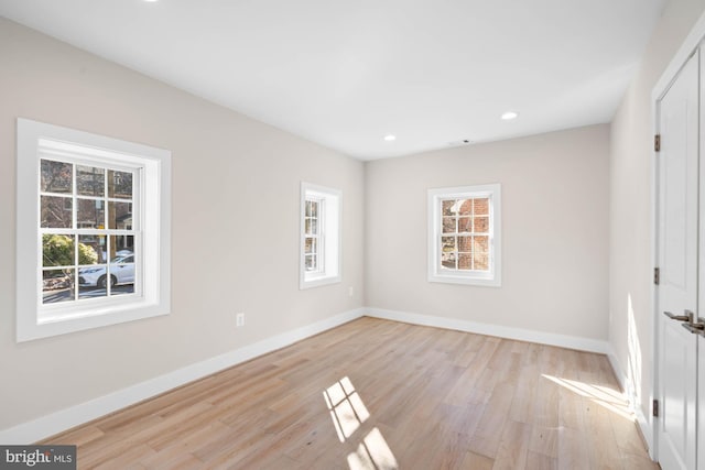 interior space featuring light wood finished floors, recessed lighting, a wealth of natural light, and baseboards