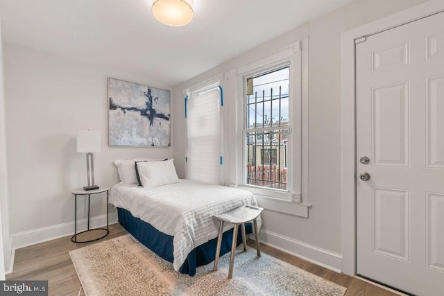 bedroom with light hardwood / wood-style flooring