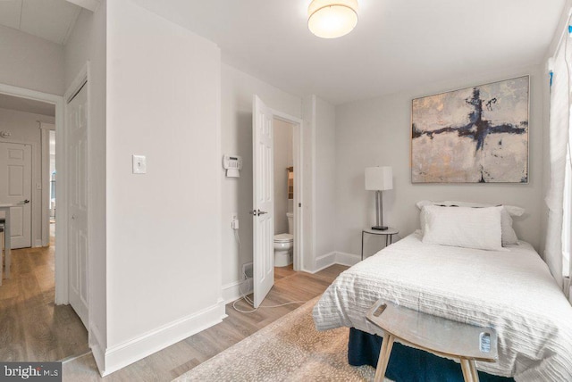 bedroom with light wood-type flooring