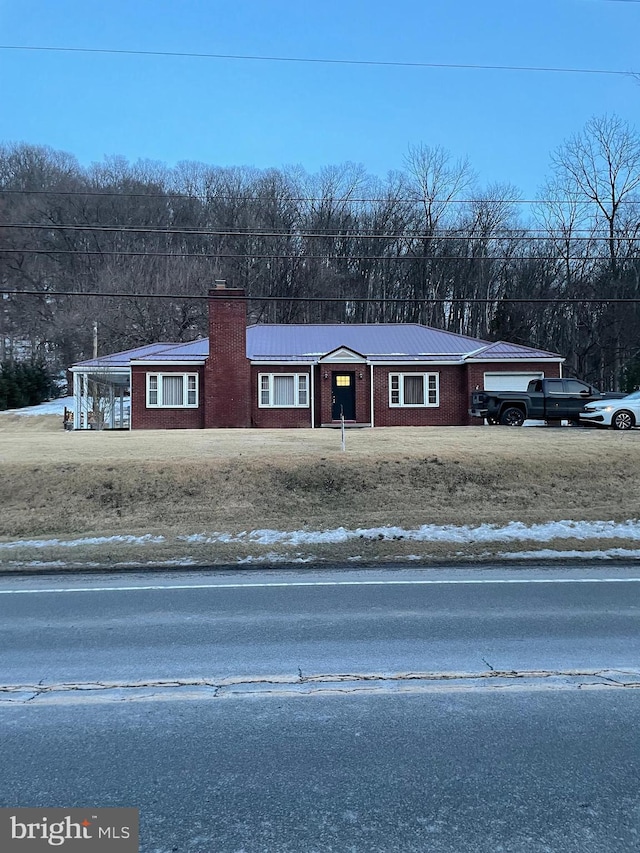 view of front of home featuring a carport