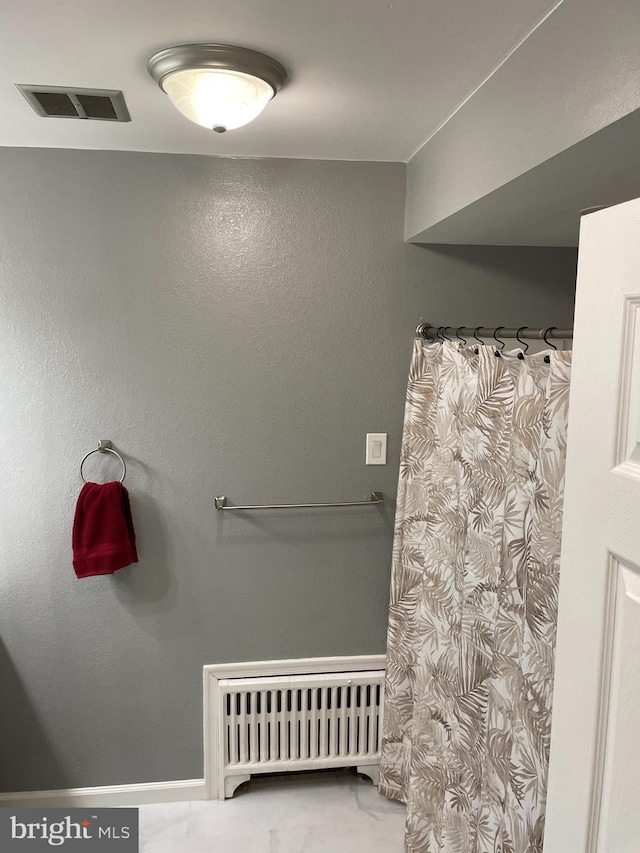 bathroom with radiator heating unit