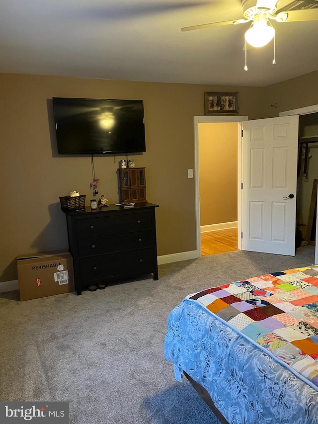 bedroom with light colored carpet and ceiling fan