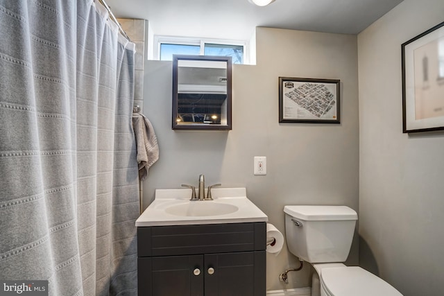 full bath featuring toilet and vanity