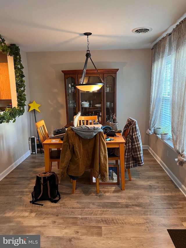 dining room featuring dark hardwood / wood-style flooring