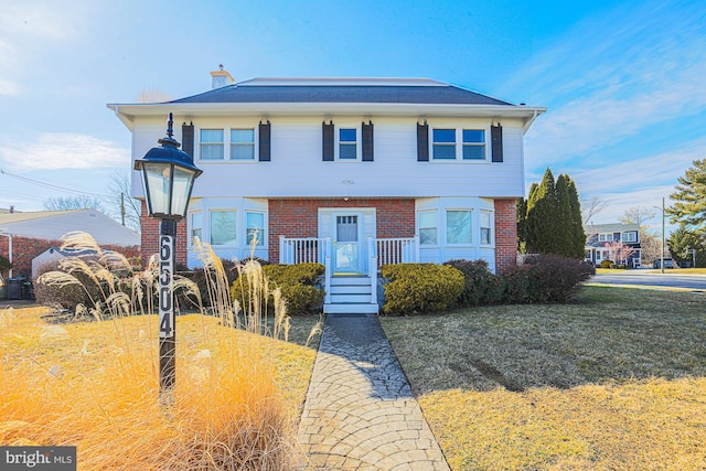 view of front of property with a front lawn