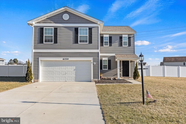 view of front of home with a garage and a front lawn