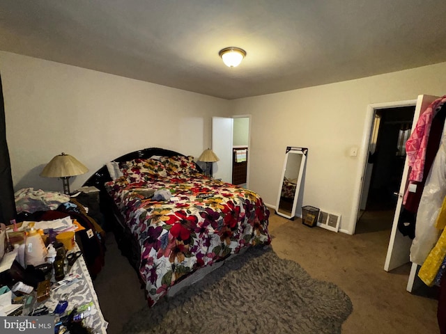 bedroom with dark carpet