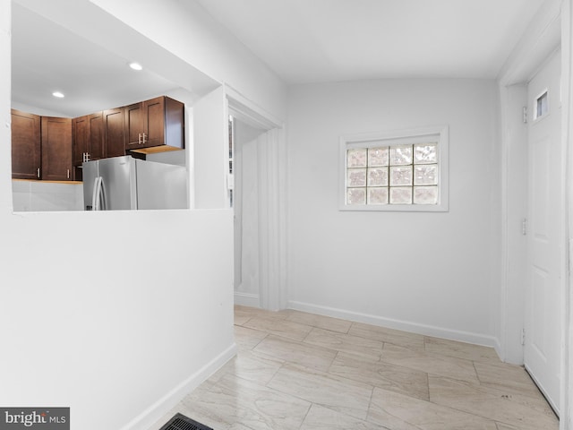 kitchen with stainless steel fridge with ice dispenser