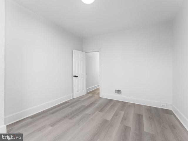 spare room featuring light hardwood / wood-style flooring