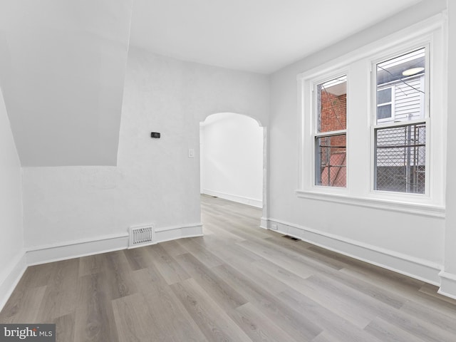 spare room featuring light hardwood / wood-style flooring