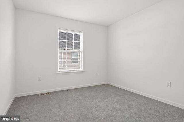 unfurnished room featuring carpet flooring