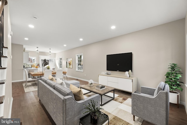 living room featuring recessed lighting, wood finished floors, and a healthy amount of sunlight