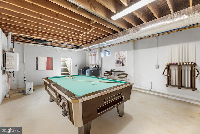 game room featuring water heater, concrete floors, and pool table