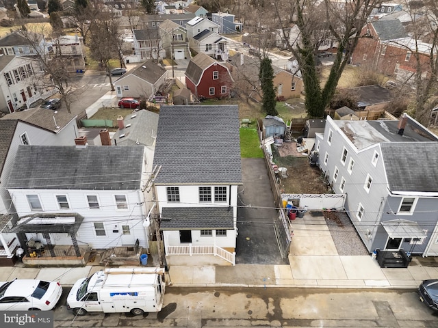 birds eye view of property with a residential view