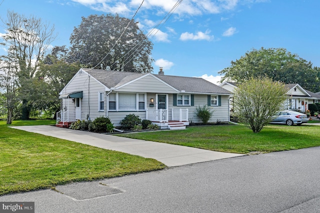 ranch-style house with a front lawn, a chimney, and a shingled roof