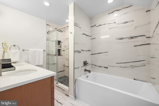 507 Janneys Ln, Alexandria, VA 22302 - bathroom with a marble finish shower, a bathtub, double vanity, recessed lighting, and marble look tiles