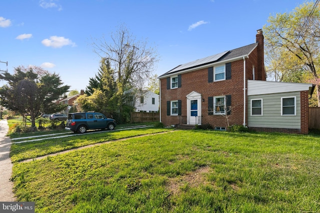 507 Janneys Ln, Alexandria, VA 22302 - view of front of home with a chimney, solar panels, and brick siding
