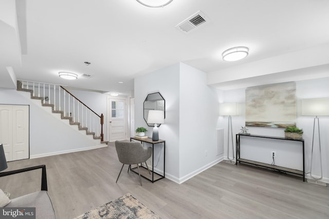 507 Janneys Ln, Alexandria, VA 22302 - living room with wood finished floors, stairs, and baseboards