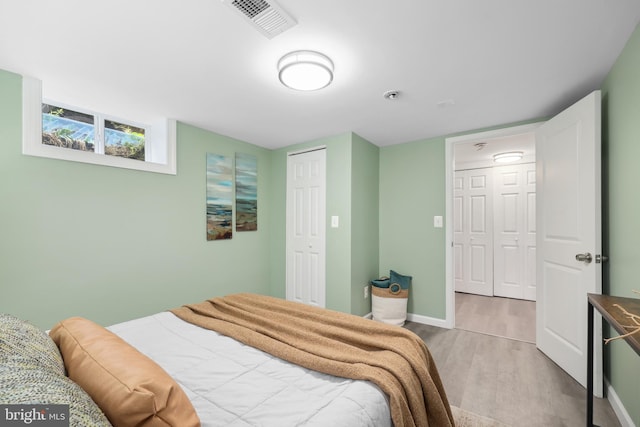 507 Janneys Ln, Alexandria, VA 22302 - bedroom with wood finished floors, baseboards, and a closet