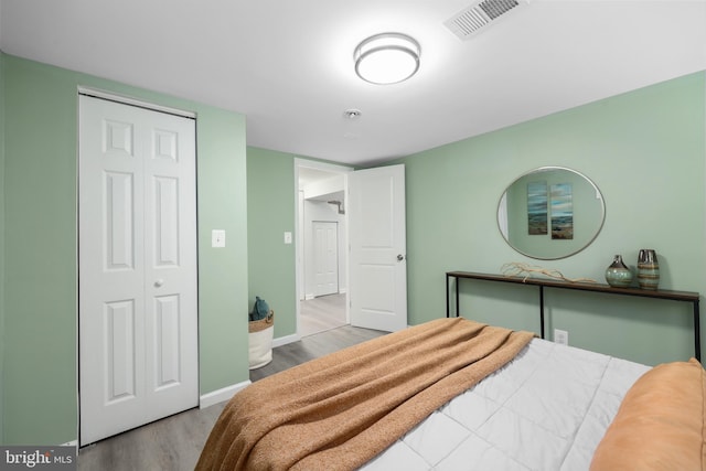 507 Janneys Ln, Alexandria, VA 22302 - bedroom with wood finished floors, baseboards, and a closet
