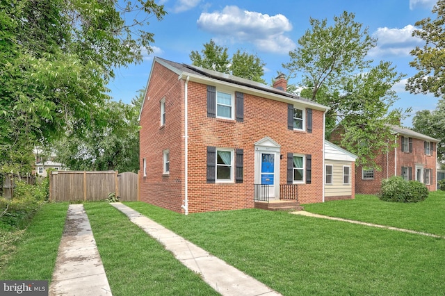 507 Janneys Ln, Alexandria, VA 22302 - colonial-style house featuring a chimney and brick siding