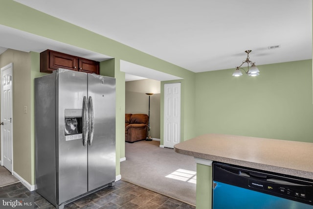 kitchen with an inviting chandelier, dark carpet, and stainless steel appliances