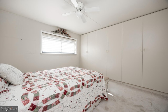 carpeted bedroom with ceiling fan