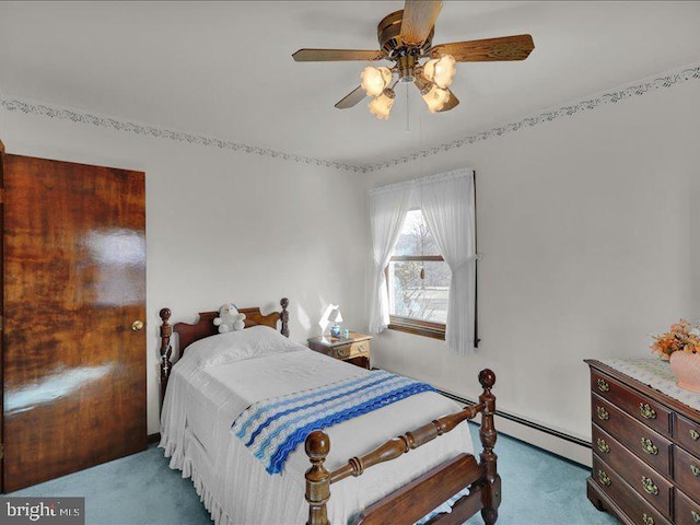 bedroom featuring ceiling fan, carpet floors, and a baseboard radiator